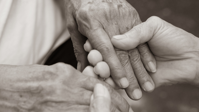 caregiver holder elders' hands